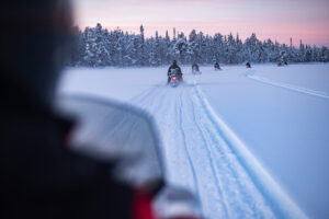 00-snowmobiling-on-the-frozen-lake-at-sunset-at-toras-2022-03-10-08-27-10-utc